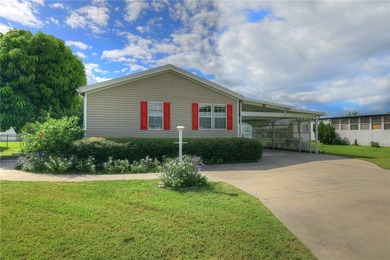 Fruit Trees, Sunshine & Freedom-it's all here on a fenced lot on Barefoot Bay Golf Course in Florida - for sale on GolfHomes.com, golf home, golf lot