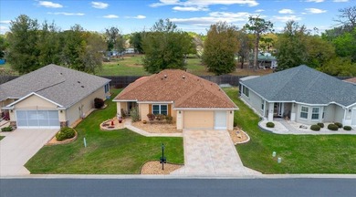 Located in Spruce Creek Golf & Country Club, this beautifully on Eagle Ridge At Spruce Creek Country Club in Florida - for sale on GolfHomes.com, golf home, golf lot