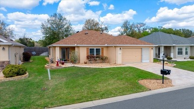 Located in Spruce Creek Golf & Country Club, this beautifully on Eagle Ridge At Spruce Creek Country Club in Florida - for sale on GolfHomes.com, golf home, golf lot