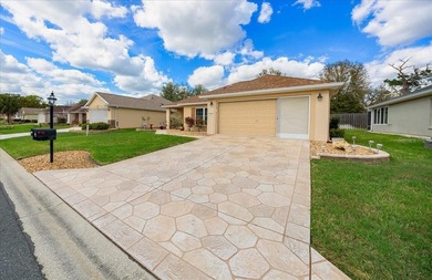 Located in Spruce Creek Golf & Country Club, this beautifully on Eagle Ridge At Spruce Creek Country Club in Florida - for sale on GolfHomes.com, golf home, golf lot