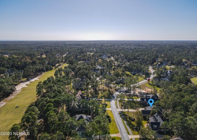 This stately home sits on a .53-acre lot within Ocean Ridge on Tigers Eye Golf Links in North Carolina - for sale on GolfHomes.com, golf home, golf lot