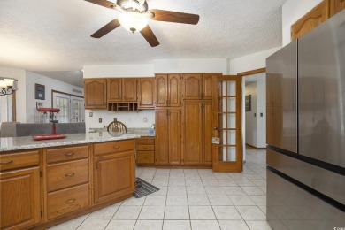 Welcome to this stunning 4-bedroom, 3-bath all-brick home on Myrtle Beach National Golf Course in South Carolina - for sale on GolfHomes.com, golf home, golf lot