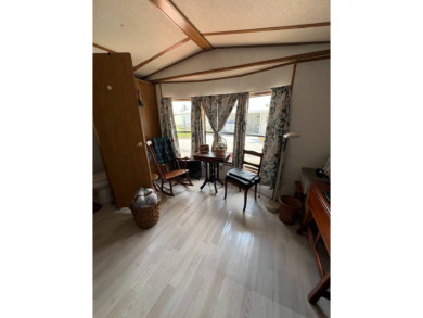 Charming 2 bed, 1.5 bath Home in 55+ Golf Community - New Roof on Lake Henry Golf Club in Florida - for sale on GolfHomes.com, golf home, golf lot