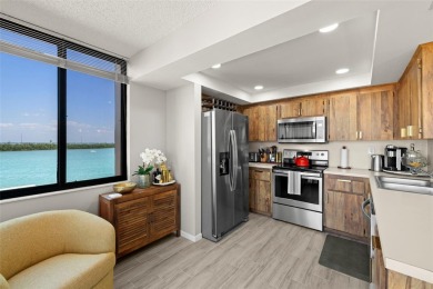 Welcome to an exquisite residence where elegance meets on Isla Del Sol Yacht and Country Club in Florida - for sale on GolfHomes.com, golf home, golf lot
