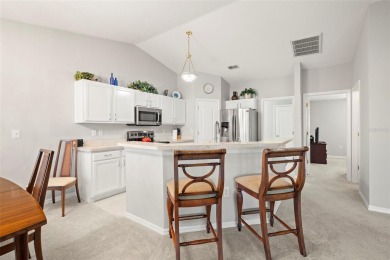 Under contract-accepting backup offers. A QUAINT MOVE-IN-READY on Tampa Bay Golf and Country Club in Florida - for sale on GolfHomes.com, golf home, golf lot