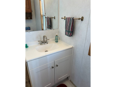 Charming 2 bed, 1.5 bath Home in 55+ Golf Community - New Roof on Lake Henry Golf Club in Florida - for sale on GolfHomes.com, golf home, golf lot