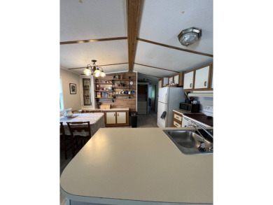 Charming 2 bed, 1.5 bath Home in 55+ Golf Community - New Roof on Lake Henry Golf Club in Florida - for sale on GolfHomes.com, golf home, golf lot