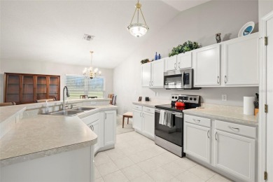 Under contract-accepting backup offers. A QUAINT MOVE-IN-READY on Tampa Bay Golf and Country Club in Florida - for sale on GolfHomes.com, golf home, golf lot