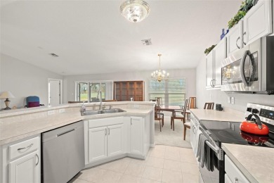 Under contract-accepting backup offers. A QUAINT MOVE-IN-READY on Tampa Bay Golf and Country Club in Florida - for sale on GolfHomes.com, golf home, golf lot