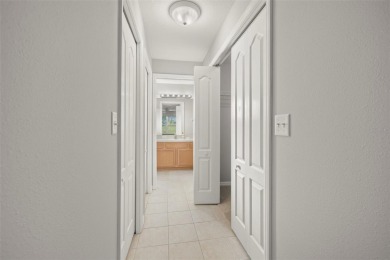 Under contract-accepting backup offers. A QUAINT MOVE-IN-READY on Tampa Bay Golf and Country Club in Florida - for sale on GolfHomes.com, golf home, golf lot