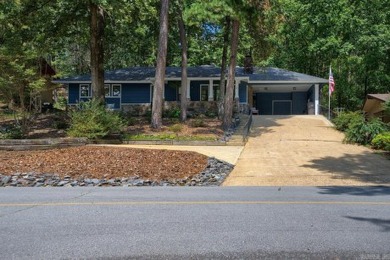 Love lake life? This freshly painted and transformed home is on DeSoto Golf Course in Arkansas - for sale on GolfHomes.com, golf home, golf lot