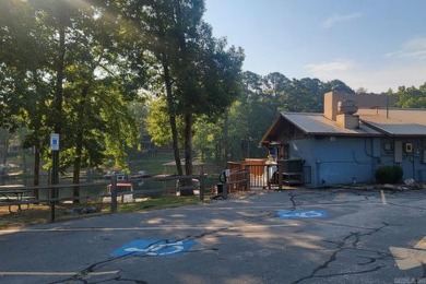 Love lake life? This freshly painted and transformed home is on DeSoto Golf Course in Arkansas - for sale on GolfHomes.com, golf home, golf lot