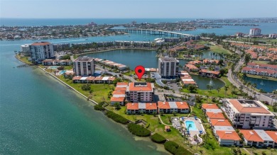 Welcome to an exquisite residence where elegance meets on Isla Del Sol Yacht and Country Club in Florida - for sale on GolfHomes.com, golf home, golf lot