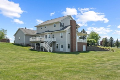 Step into timeless elegance with this stunning two-story on Dyersville Golf and Country Club in Iowa - for sale on GolfHomes.com, golf home, golf lot
