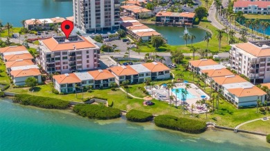 Welcome to an exquisite residence where elegance meets on Isla Del Sol Yacht and Country Club in Florida - for sale on GolfHomes.com, golf home, golf lot