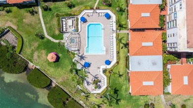 Welcome to an exquisite residence where elegance meets on Isla Del Sol Yacht and Country Club in Florida - for sale on GolfHomes.com, golf home, golf lot