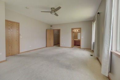 This description highlights a spacious Carmel model home on The Links at Carillon in Illinois - for sale on GolfHomes.com, golf home, golf lot