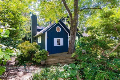 Nestled in the maritime forest of Pine Knoll Shores, this island on The Country Club of the Crystal Coast in North Carolina - for sale on GolfHomes.com, golf home, golf lot