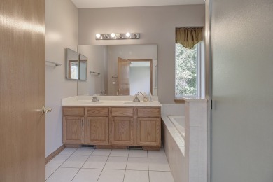 This description highlights a spacious Carmel model home on The Links at Carillon in Illinois - for sale on GolfHomes.com, golf home, golf lot
