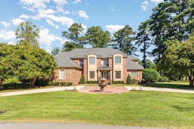 Experience luxury living where waterfront serenity meets golf on Country Club of Johnston County in North Carolina - for sale on GolfHomes.com, golf home, golf lot