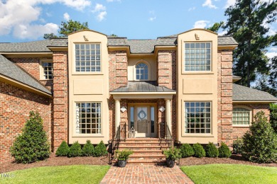 Experience luxury living where waterfront serenity meets golf on Country Club of Johnston County in North Carolina - for sale on GolfHomes.com, golf home, golf lot