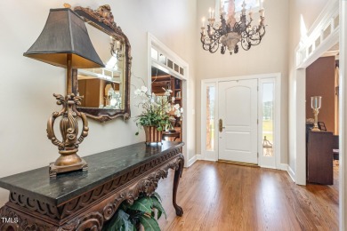 Experience luxury living where waterfront serenity meets golf on Country Club of Johnston County in North Carolina - for sale on GolfHomes.com, golf home, golf lot