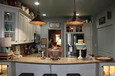 This beautifully crafted custom brick duplex is full of charm on Rolling Hills Country Club in Kentucky - for sale on GolfHomes.com, golf home, golf lot
