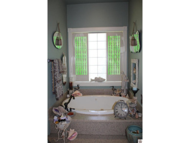 This beautifully crafted custom brick duplex is full of charm on Rolling Hills Country Club in Kentucky - for sale on GolfHomes.com, golf home, golf lot