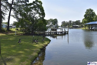 Deeded lot all the way down to the water in Roland subdivision on Players Course At Wyboo Plantation in South Carolina - for sale on GolfHomes.com, golf home, golf lot