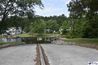 Deeded lot all the way down to the water in Roland subdivision on Players Course At Wyboo Plantation in South Carolina - for sale on GolfHomes.com, golf home, golf lot