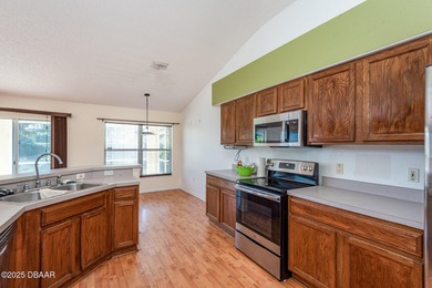 Welcome to this beautifully maintained 3-bedroom, 2-bath home on LPGA International Golf Course in Florida - for sale on GolfHomes.com, golf home, golf lot