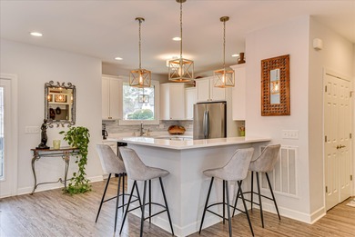 From the moment you step inside 121 Troon Way, the impact is on Houndslake Country Club in South Carolina - for sale on GolfHomes.com, golf home, golf lot