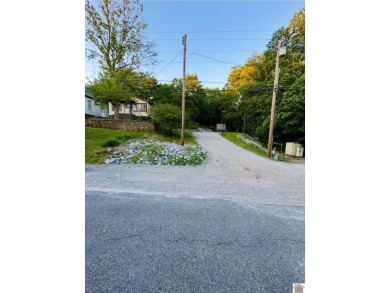 Discover an exceptional opportunity to build your dream home on Mineral Mound Golf Course in Kentucky - for sale on GolfHomes.com, golf home, golf lot