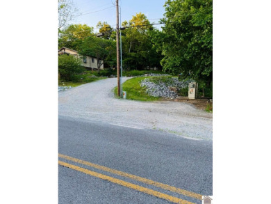 Discover an exceptional opportunity to build your dream home on Mineral Mound Golf Course in Kentucky - for sale on GolfHomes.com, golf home, golf lot