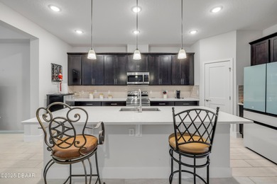 Discover this 4-bed, 3-bath home in Halifax Plantation with 2 on Halifax Plantation Golf Club in Florida - for sale on GolfHomes.com, golf home, golf lot