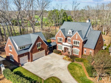 This beautiful brick home built by Kingswood Builders overlooks on Quail Hollow Club in North Carolina - for sale on GolfHomes.com, golf home, golf lot
