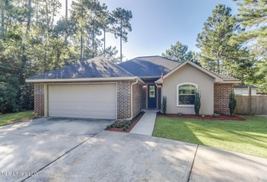 Located in the heart of Diamondhead, this 3-bedroom, 2-bath home on Diamondhead Country Club in Mississippi - for sale on GolfHomes.com, golf home, golf lot