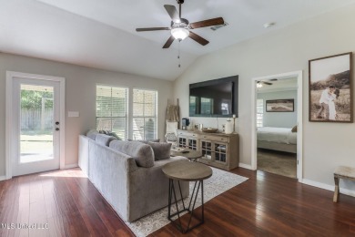 Located in the heart of Diamondhead, this 3-bedroom, 2-bath home on Diamondhead Country Club in Mississippi - for sale on GolfHomes.com, golf home, golf lot