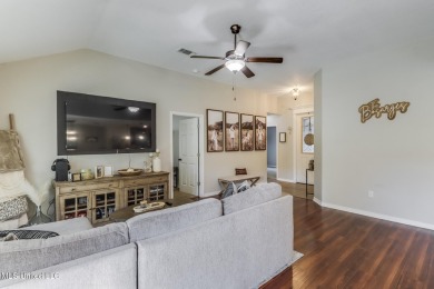 Located in the heart of Diamondhead, this 3-bedroom, 2-bath home on Diamondhead Country Club in Mississippi - for sale on GolfHomes.com, golf home, golf lot