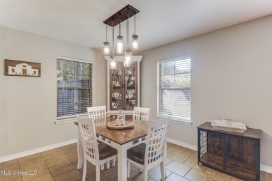Located in the heart of Diamondhead, this 3-bedroom, 2-bath home on Diamondhead Country Club in Mississippi - for sale on GolfHomes.com, golf home, golf lot