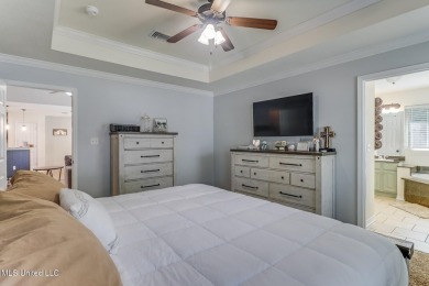Located in the heart of Diamondhead, this 3-bedroom, 2-bath home on Diamondhead Country Club in Mississippi - for sale on GolfHomes.com, golf home, golf lot