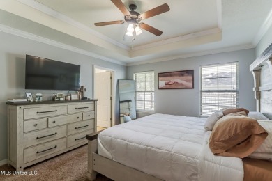 Located in the heart of Diamondhead, this 3-bedroom, 2-bath home on Diamondhead Country Club in Mississippi - for sale on GolfHomes.com, golf home, golf lot
