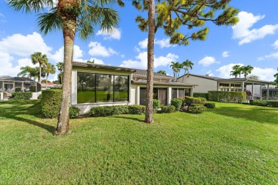 Enjoy golf and water views from this charming one-story on Delray Dunes Golf and Country Club in Florida - for sale on GolfHomes.com, golf home, golf lot