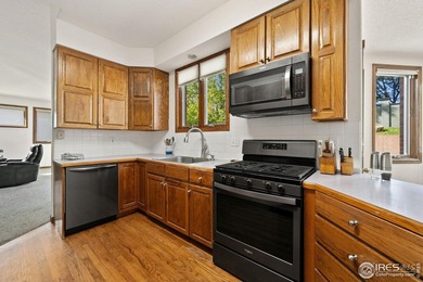 All-brick charmer on a cul-de-sac! This gorgeous home in the on The Olde Course At Loveland in Colorado - for sale on GolfHomes.com, golf home, golf lot