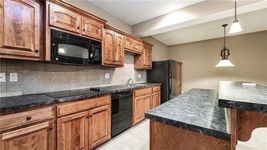 Exceptional property located in maintenance-free Siena on Fred Arbanas Golf Course At Longview Lakes - Longview Lake in Missouri - for sale on GolfHomes.com, golf home, golf lot