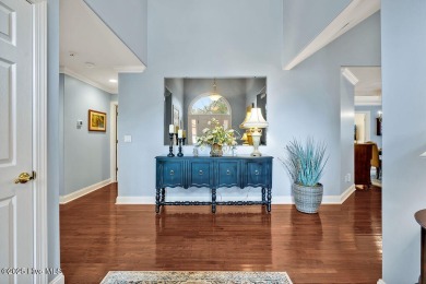Enjoy serene pond views with this stunning brick home located in on Cape Fear National At Brunswick Forest in North Carolina - for sale on GolfHomes.com, golf home, golf lot
