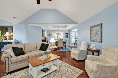 Enjoy serene pond views with this stunning brick home located in on Cape Fear National At Brunswick Forest in North Carolina - for sale on GolfHomes.com, golf home, golf lot