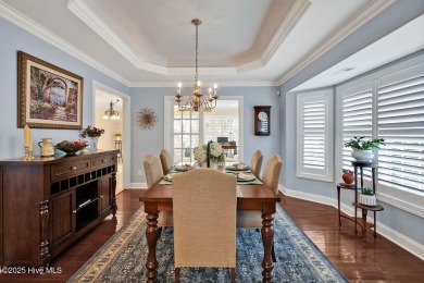 Enjoy serene pond views with this stunning brick home located in on Cape Fear National At Brunswick Forest in North Carolina - for sale on GolfHomes.com, golf home, golf lot