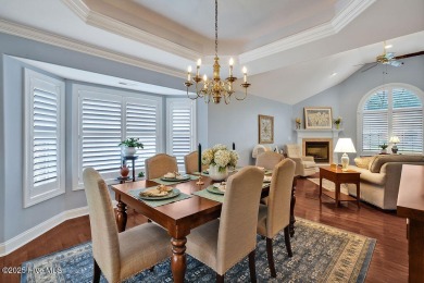 Enjoy serene pond views with this stunning brick home located in on Cape Fear National At Brunswick Forest in North Carolina - for sale on GolfHomes.com, golf home, golf lot
