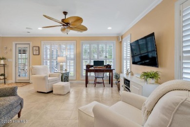 Enjoy serene pond views with this stunning brick home located in on Cape Fear National At Brunswick Forest in North Carolina - for sale on GolfHomes.com, golf home, golf lot